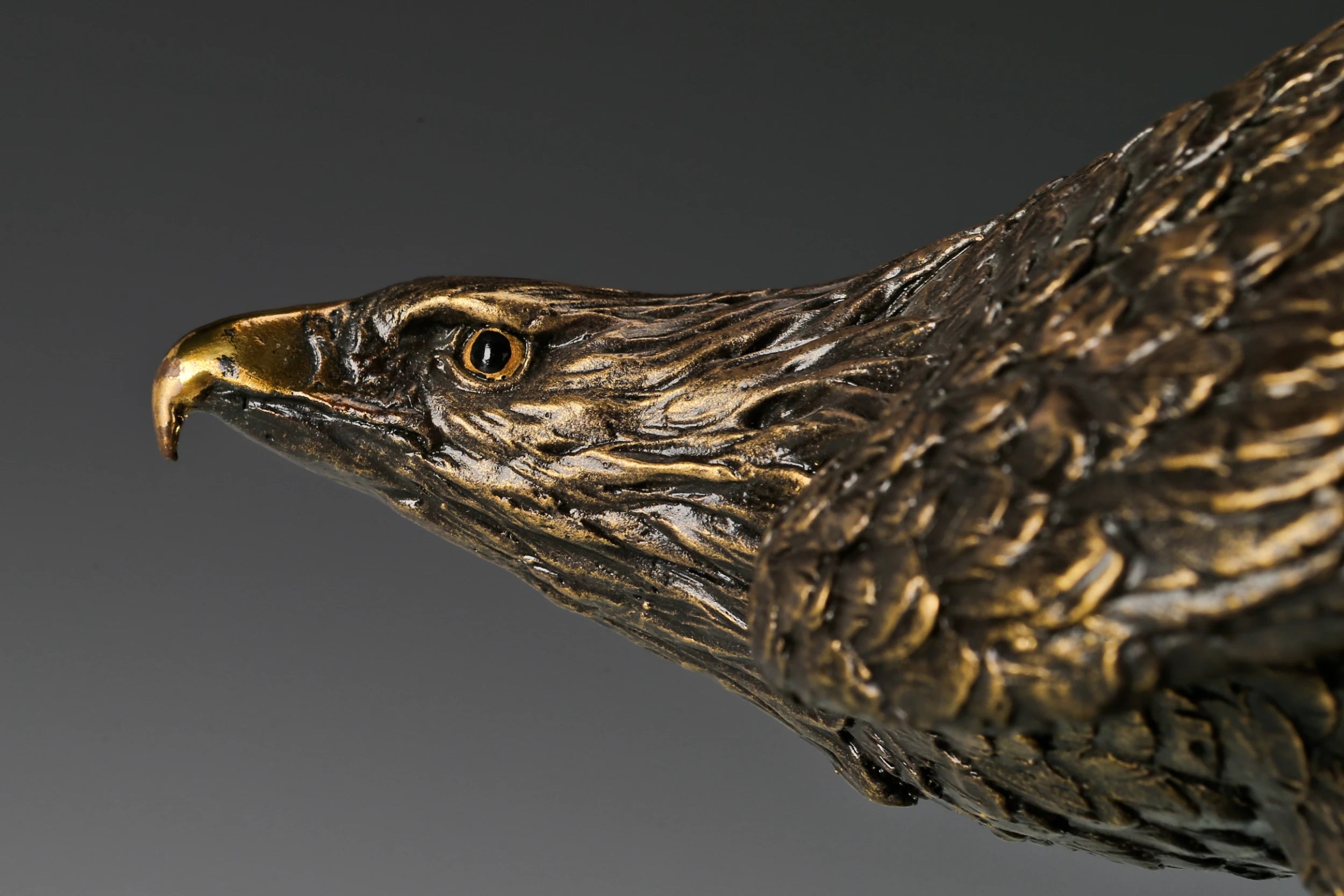 Bronze eagle sculpture ready to fly with wings partially spread and marble base. A powerful symbol of strength, freedom, and ambition.
