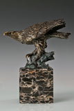 Pre-flight bronze eagle sculpture with detailed feathers and natural base. Elegant wildlife statue for home decor, office, or collectors.
