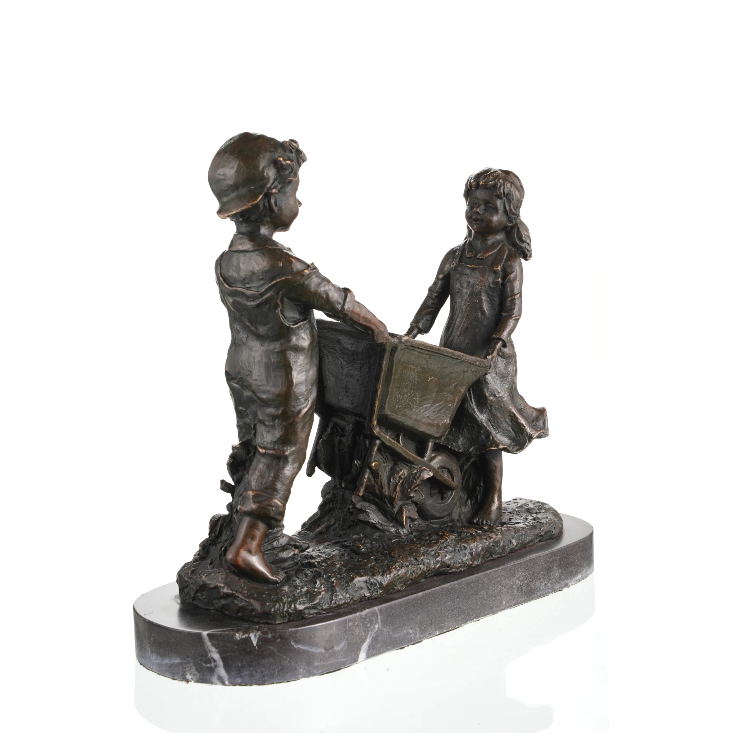 Nostalgic bronze sculpture of a boy and girl with a wheelbarrow on black marble base, heartwarming children playing art for home decor.