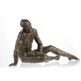 Contemporary bronze sculpture of a crouching male figure covered in chess motifs. A powerful symbol of strategy, control, and the human condition.