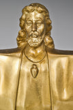 Close-up of Christ the Redeemer bronze statue showing Jesus facial features and robe details