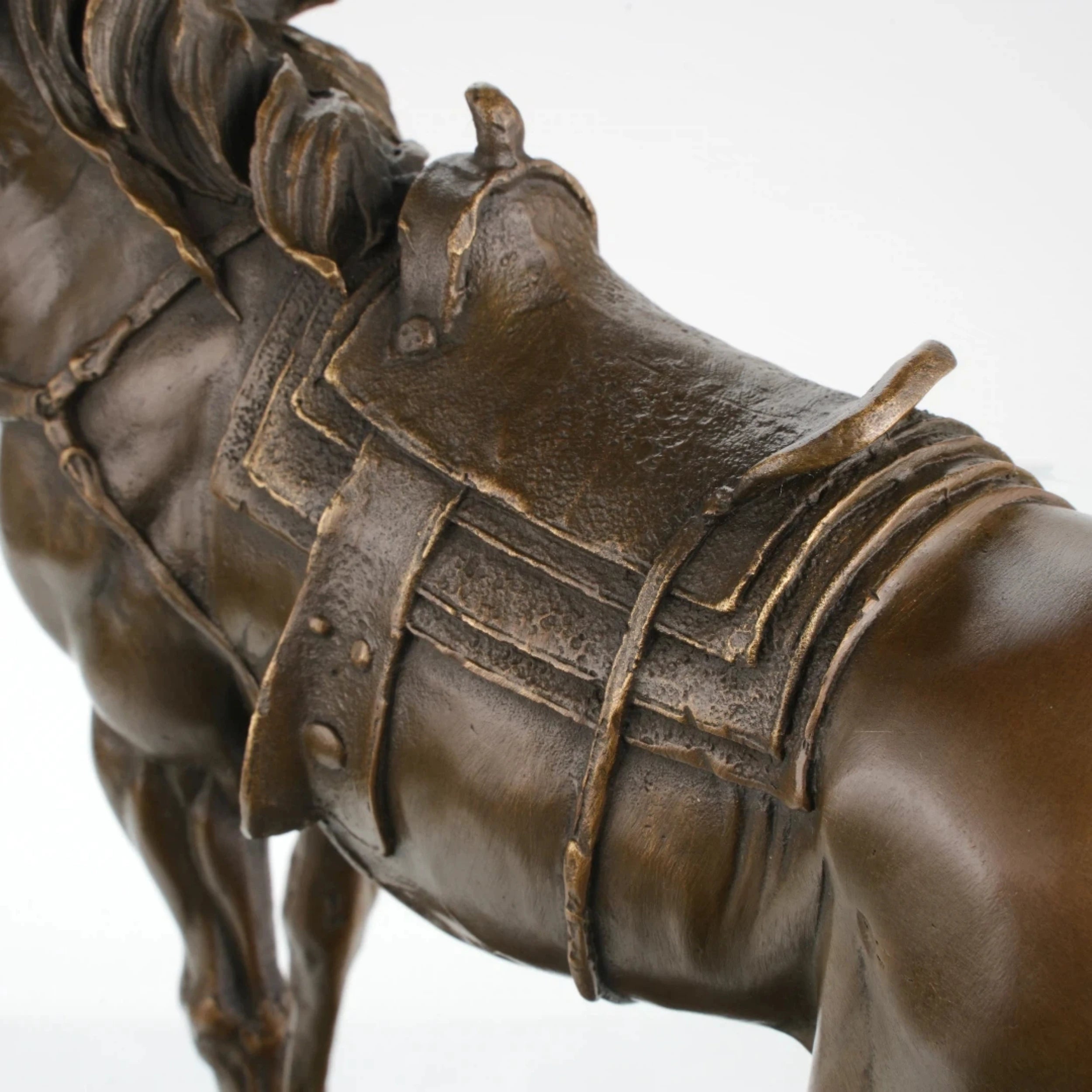 Realistic saddled standing horse bronze sculpture with detailed saddle on marble base