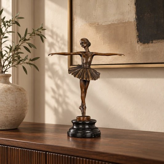 Classical ballerina bronze sculpture displayed on a console table in an elegant living room