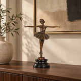 Classical ballerina bronze sculpture displayed on a console table in an elegant living room
