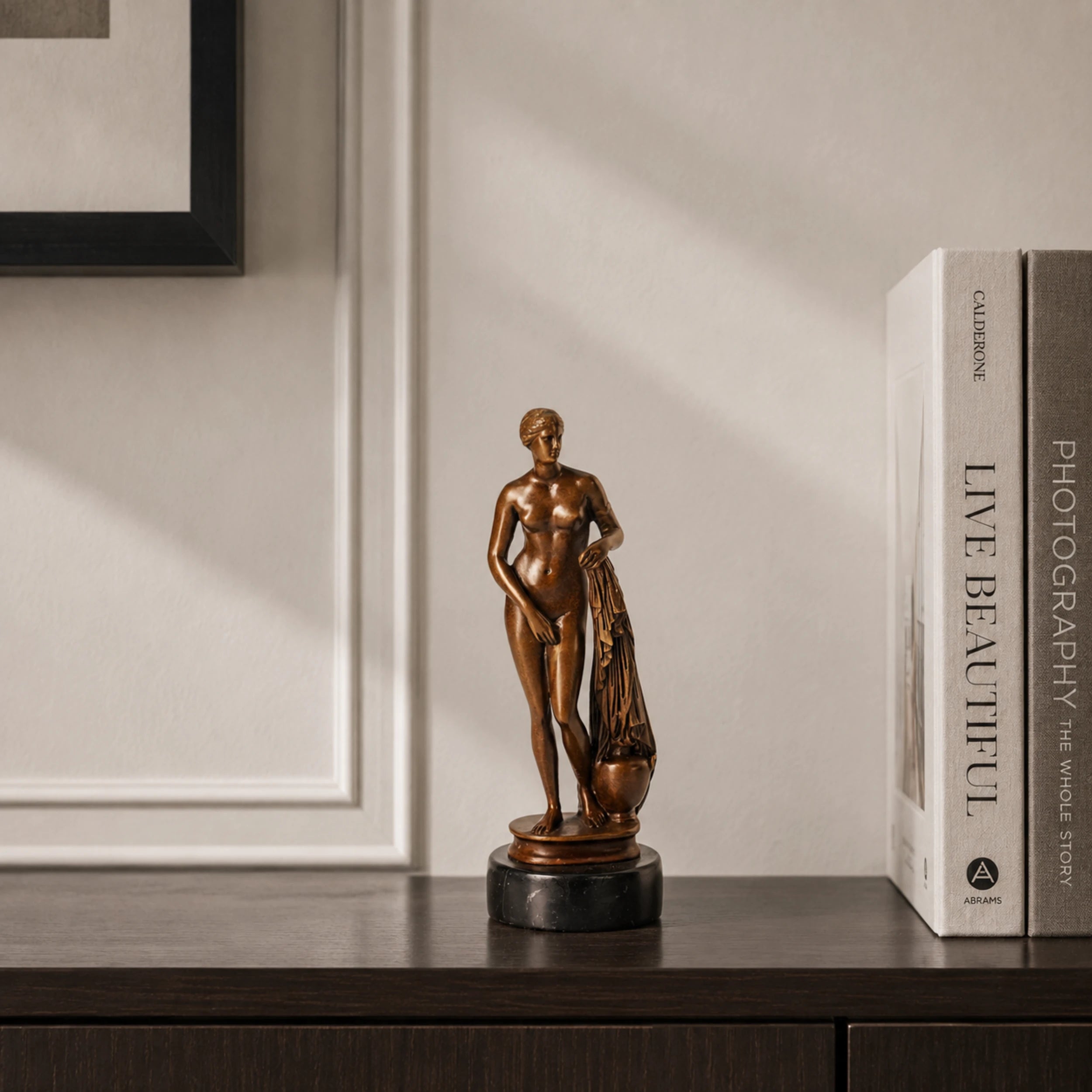Classical Female Nude Bronze Sculpture displayed in a styled interior
