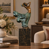 Dancing female bronze sculpture with flowing dress displayed in a modern interior
