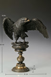 Bronze eagle statue with wings partially spread and decorative base. Classical wildlife sculpture for home decor, office, or collectors.