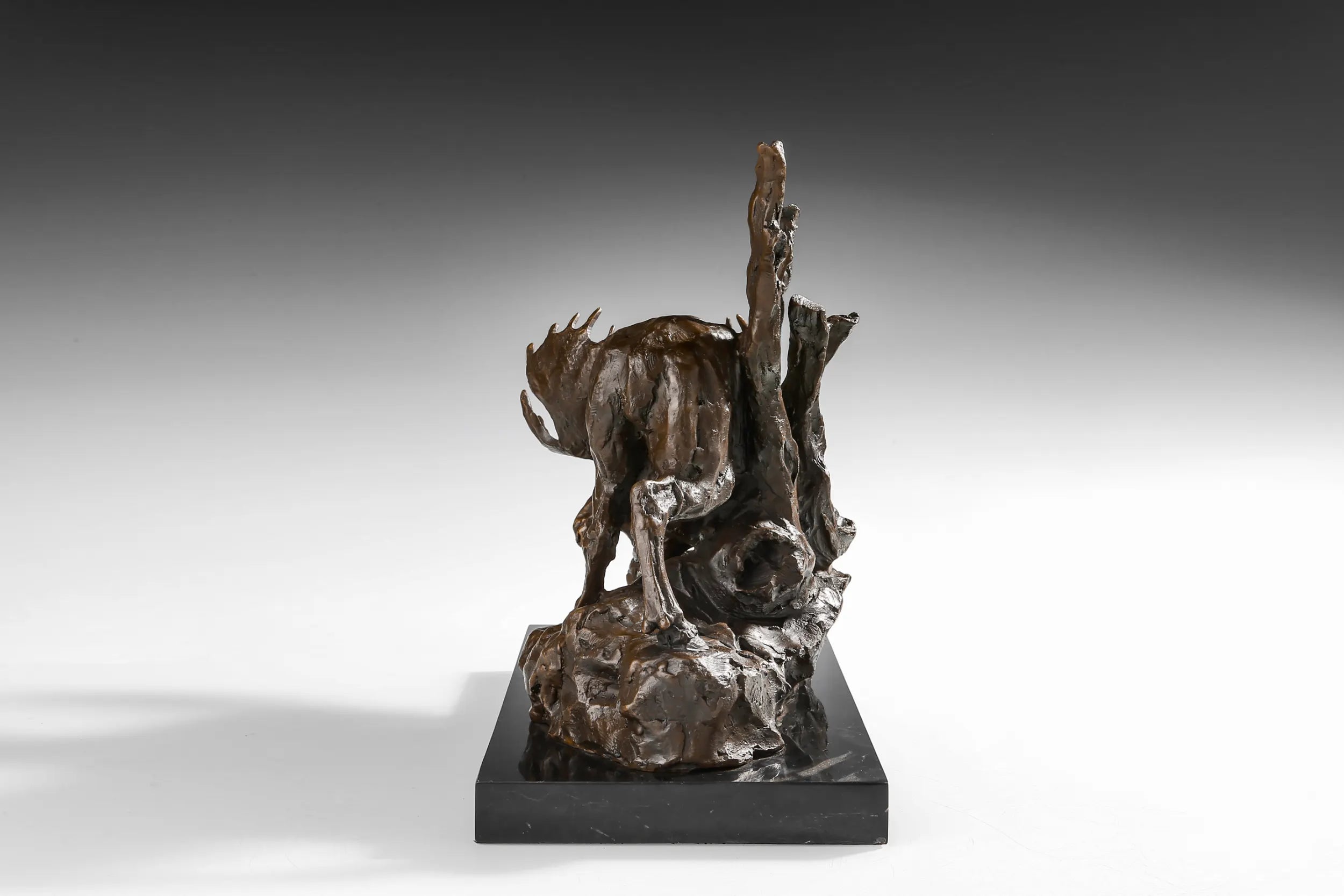 Descending Moose bronze sculpture side view