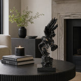 This is a dynamic bronze statue of a bald eagle, crafted using the lost-wax casting method. The piece captures the raptor in a powerful diving pose—wings partially spread, talons extended forward, and body angled downward—conveying the raw intensity and precision of a hunting strike.