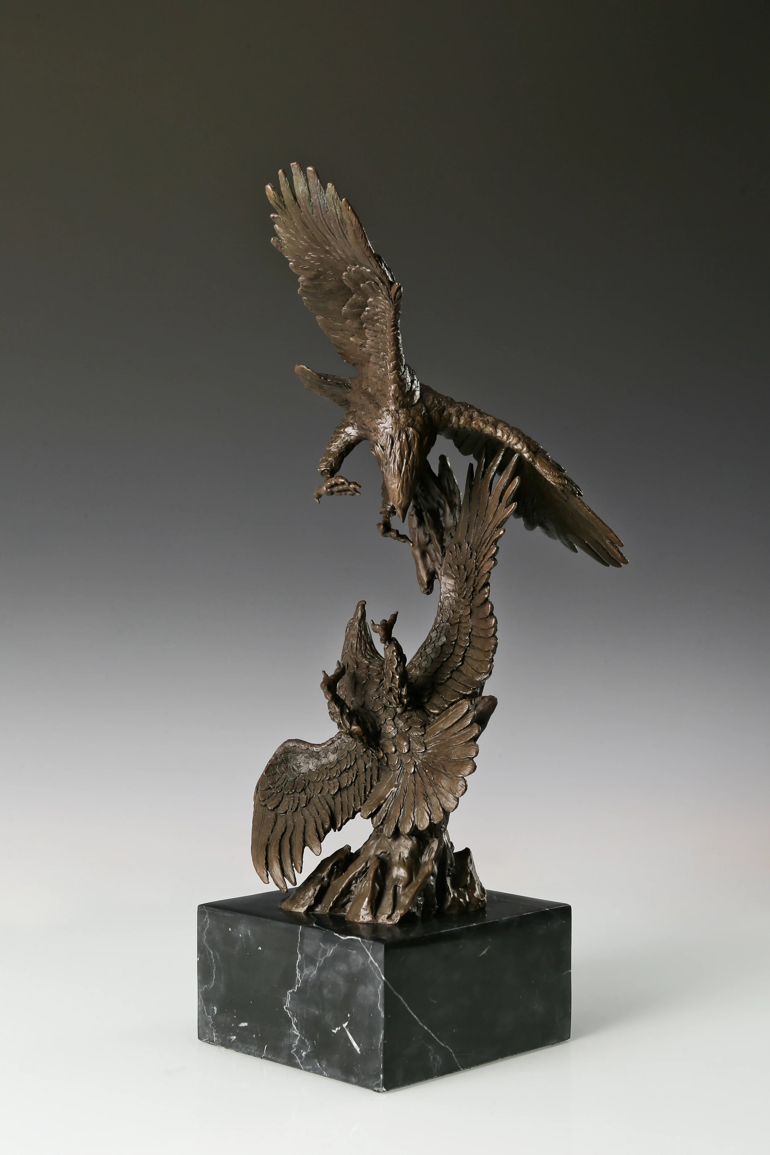 Two eagles bronze sculpture in dynamic interaction pose with detailed feathers and marble base. Elegant decor for home, office, or collectors.