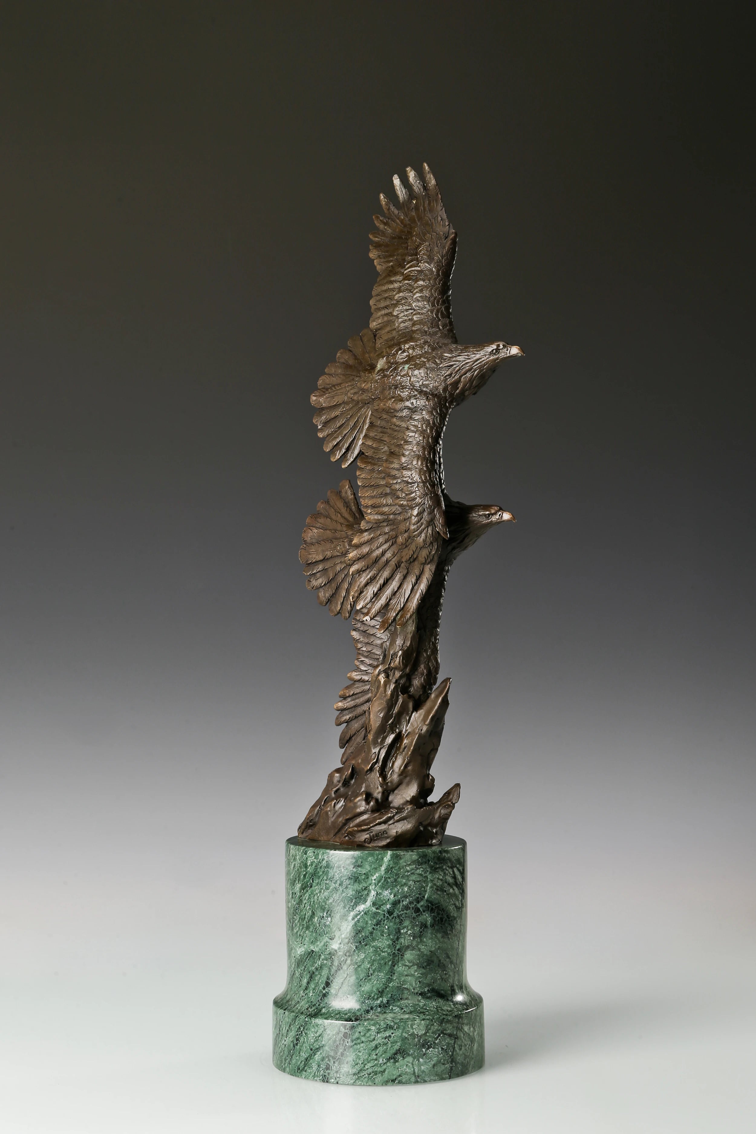 Solid bronze twin eagles soaring statue on green marble base, luxury office desk decor for executives.