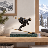 Abstract bronze skier statue displayed as modern ski lodge, winter sports, and office decor