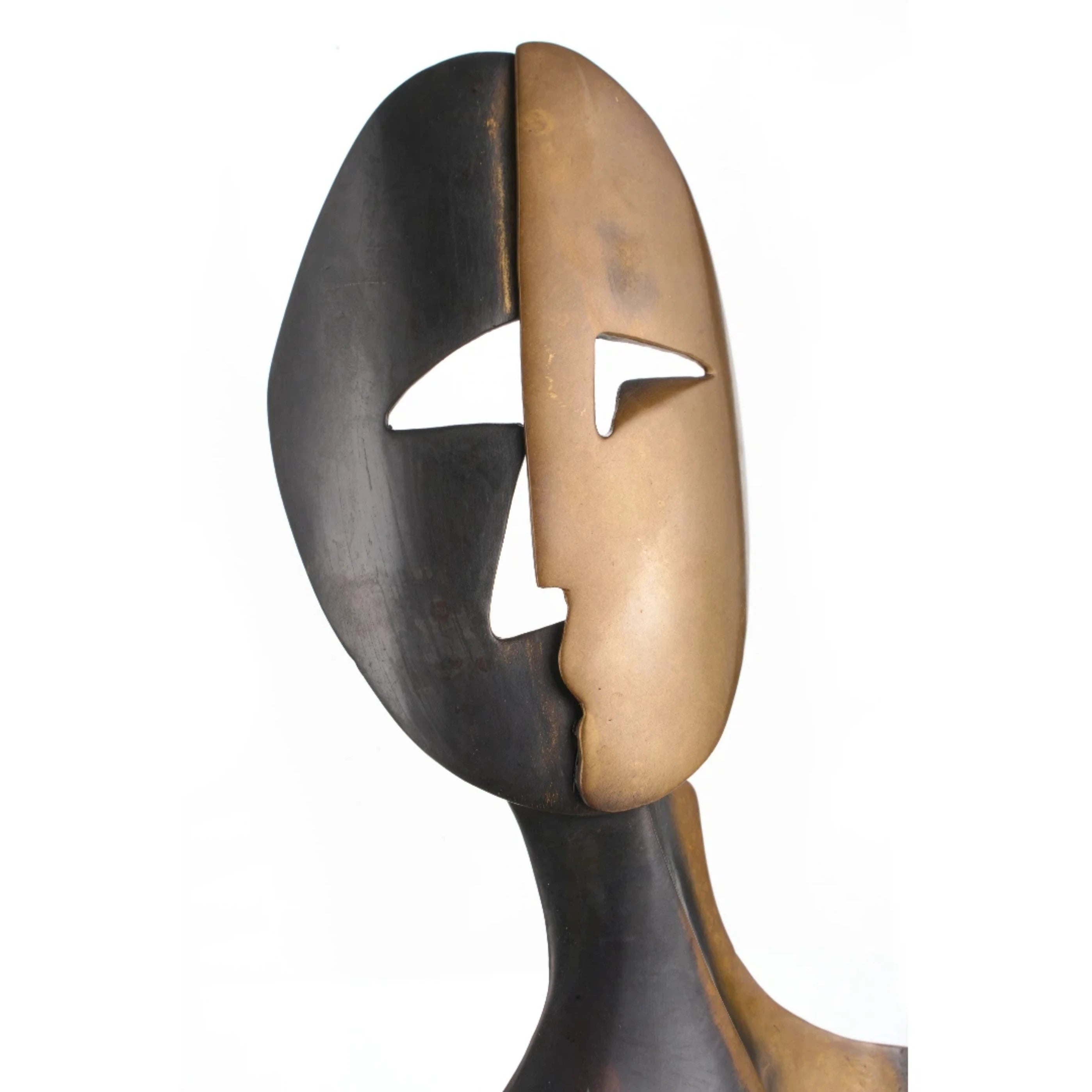 Dual-tone split face detail in bronze sculpture