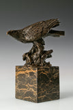 Pre-flight bronze eagle sculpture with detailed feathers and natural base. Elegant wildlife statue for home decor, office, or collectors.