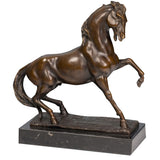 Refined prancing bronze horse sculpture with raised foreleg and flowing mane, realistic equestrian statue on black marble base, lost wax casting fine art.