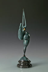 Rear view of female gymnast bronze sculpture in a one-legged balancing pose