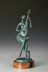 Angled front view of a seated woman playing the pipa with green patina and a round wooden base