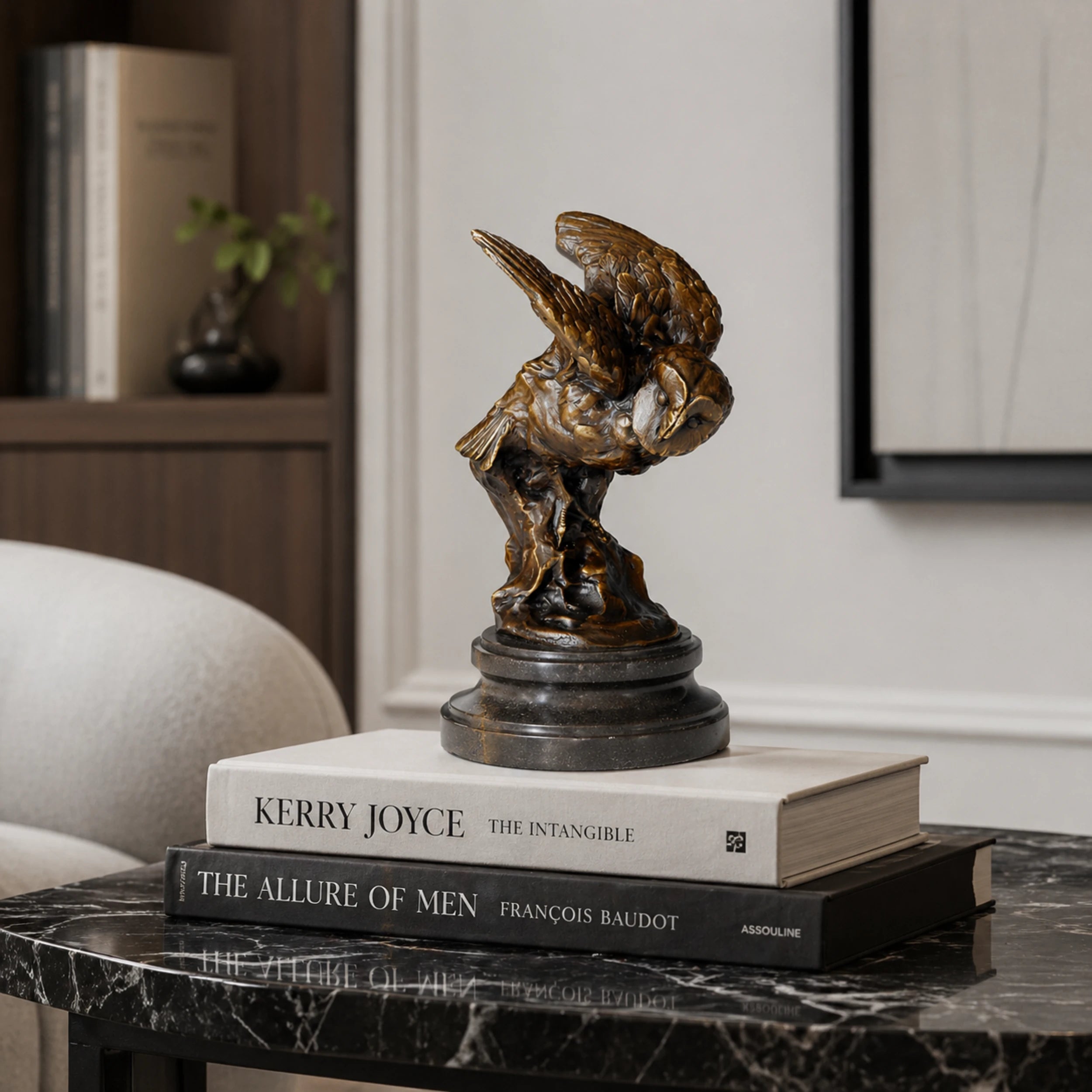 A bronze owl statue capturing the powerful moment of flight. Detailed feather textures and a black marble base make this wildlife statue perfect for home or office decor.