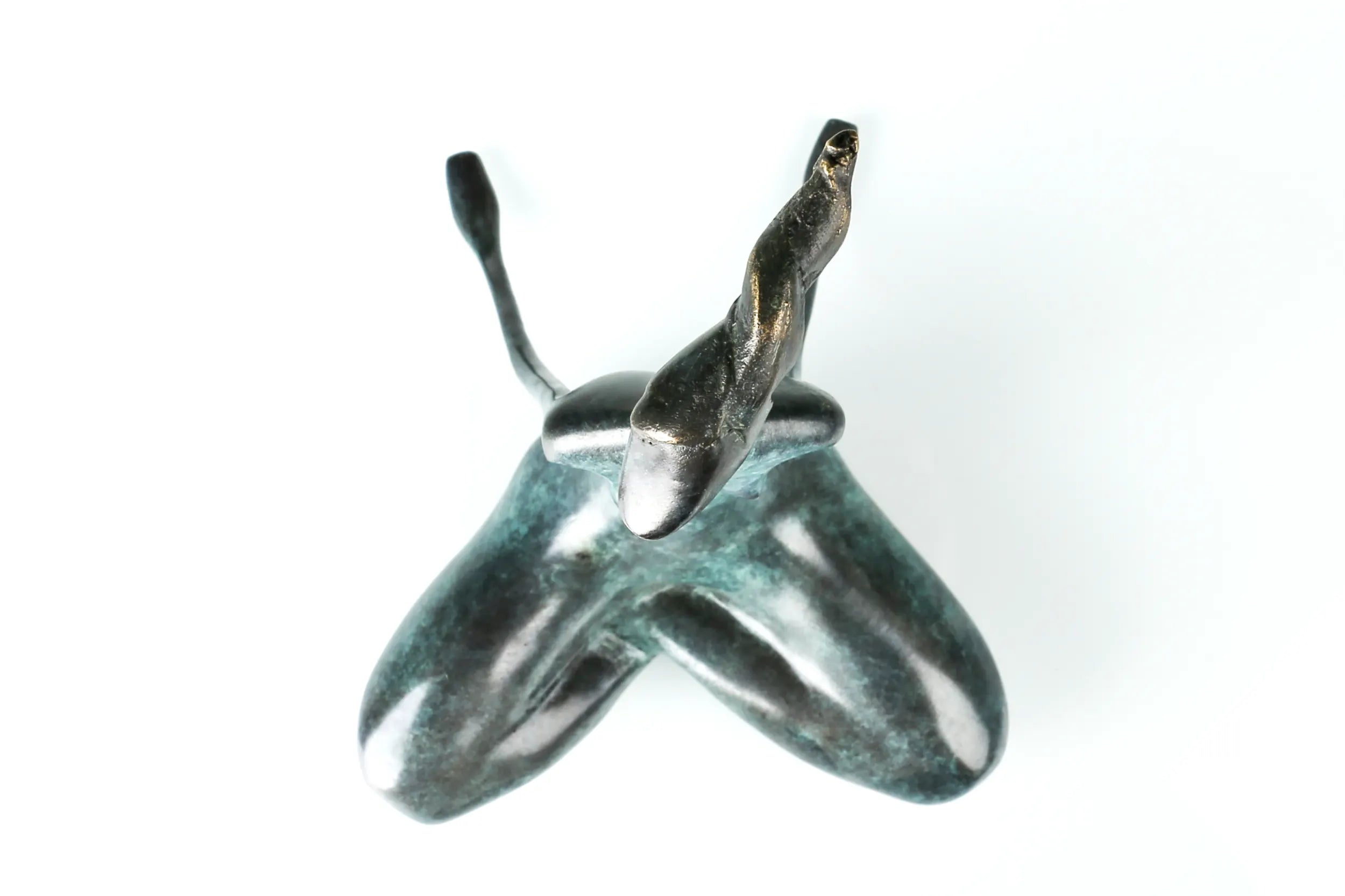 Top view of abstract yoga woman bronze sculpture showing the cross-legged pose