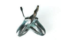 Top view of abstract yoga woman bronze sculpture showing the cross-legged pose