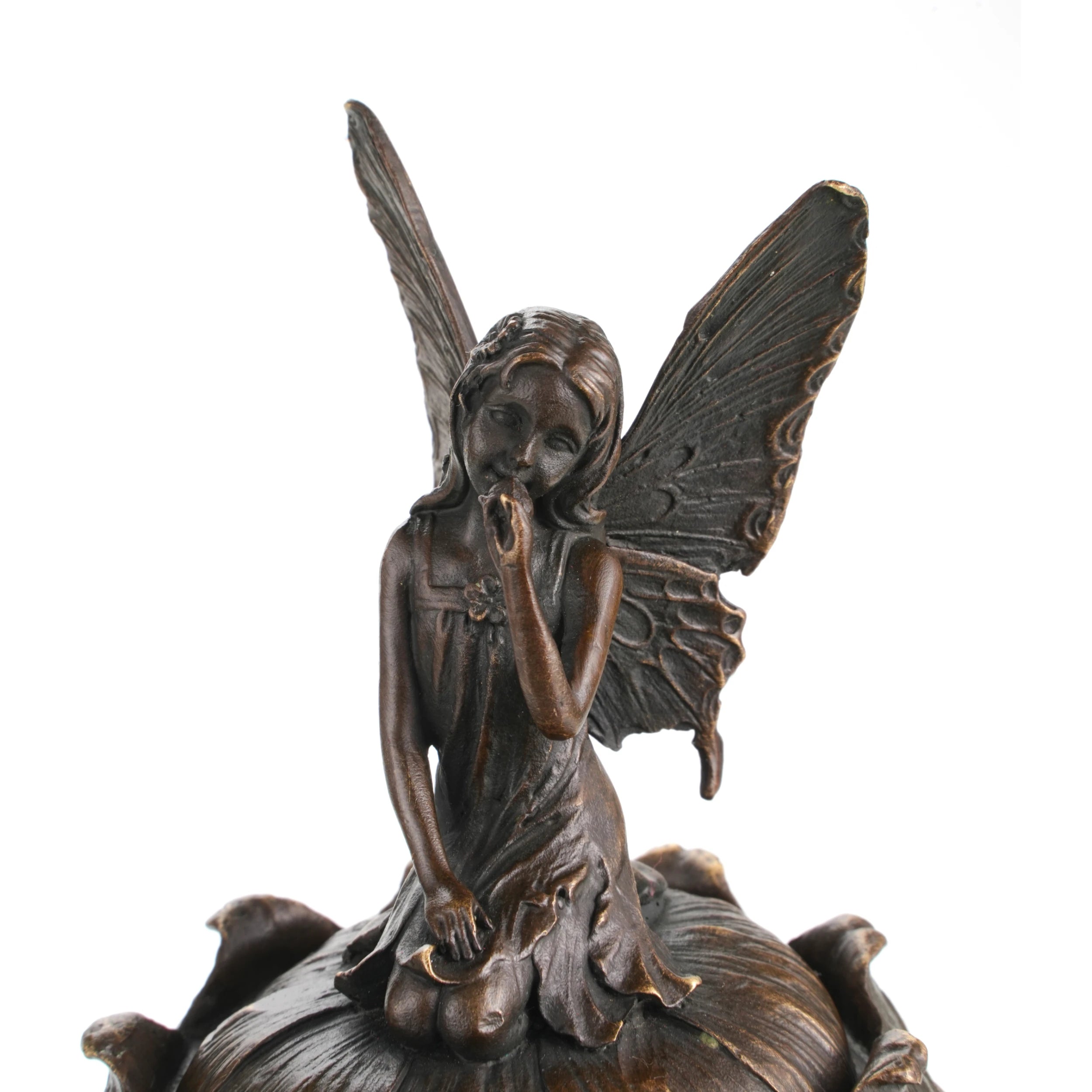 Close-up detail of fairy sculpture with butterfly wings and antique bronze finish