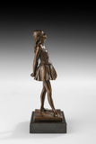 Right side view of handcrafted bronze student girl statue with detailed dress and shoes
