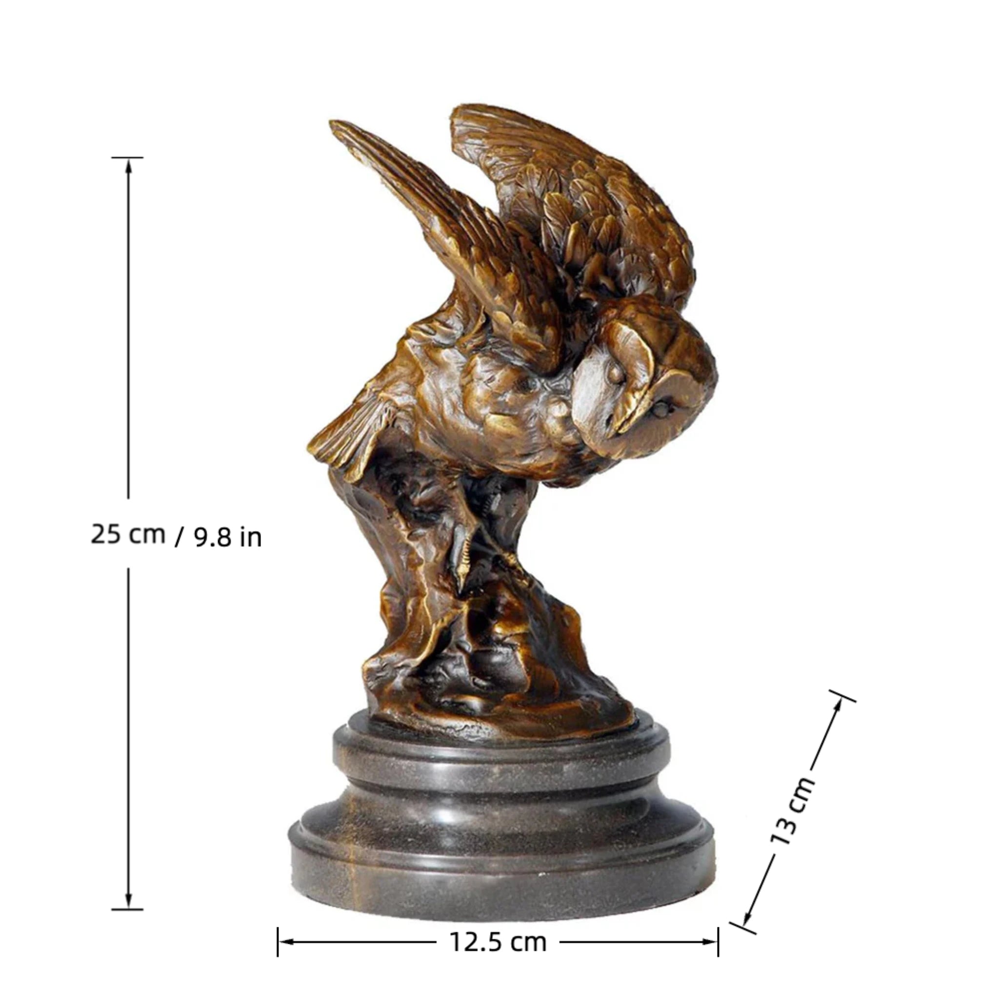 A bronze owl statue capturing the powerful moment of flight. Detailed feather textures and a black marble base make this wildlife statue perfect for home or office decor.