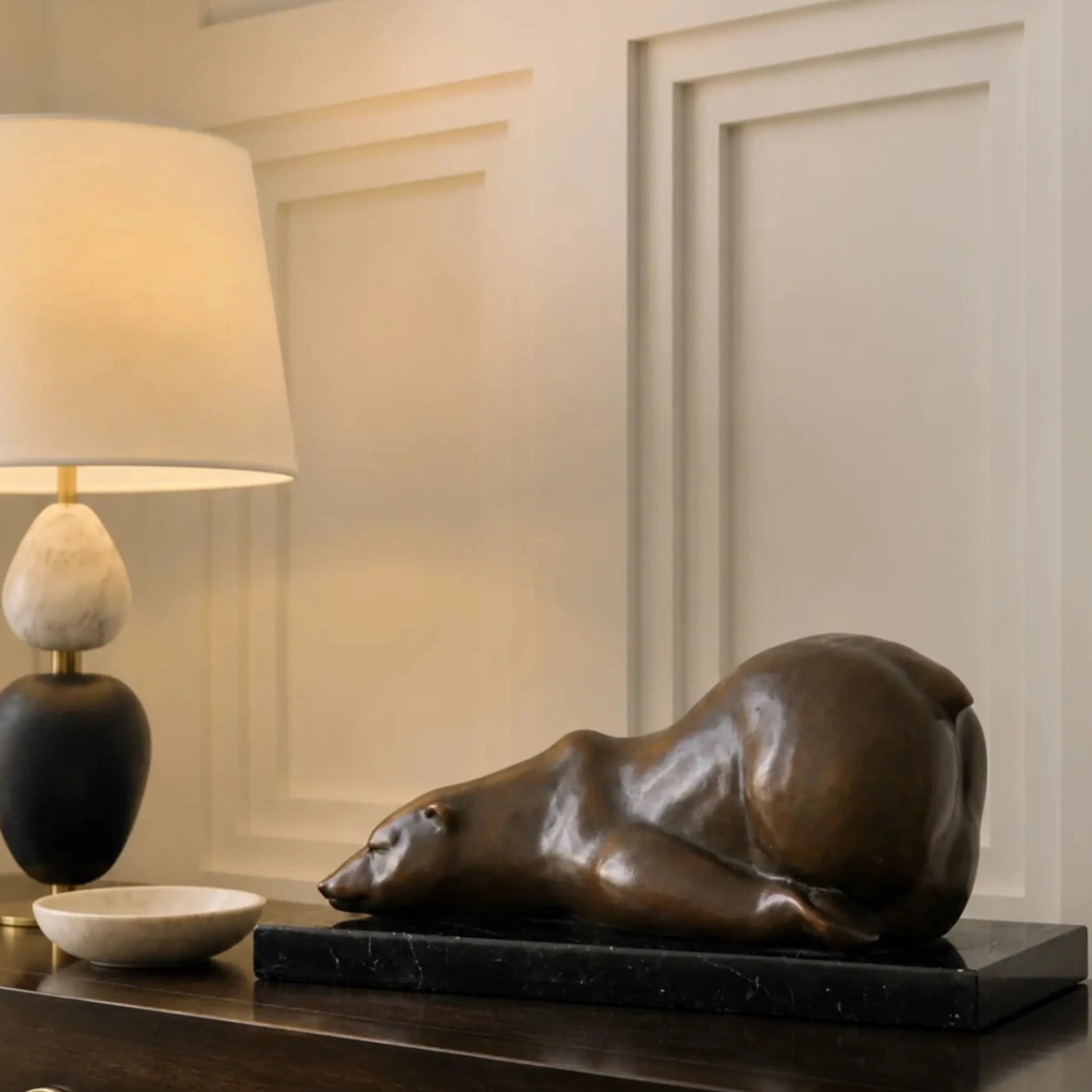 handcrafted sleeping polar bear bronze statue with a rich bronze patina and marble base, a peaceful wildlife accent for home or office.