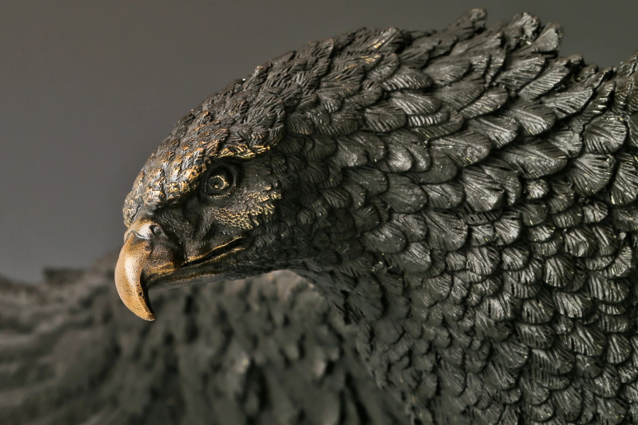 Majestic bald eagle bronze sculpture with wings spread and talons extended. A powerful wildlife statue symbolizing freedom, strength, and leadership.