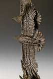 Double eagle bronze sculpture featuring two soaring eagles with wings spread. A powerful symbol of freedom, strength, and aspiration.