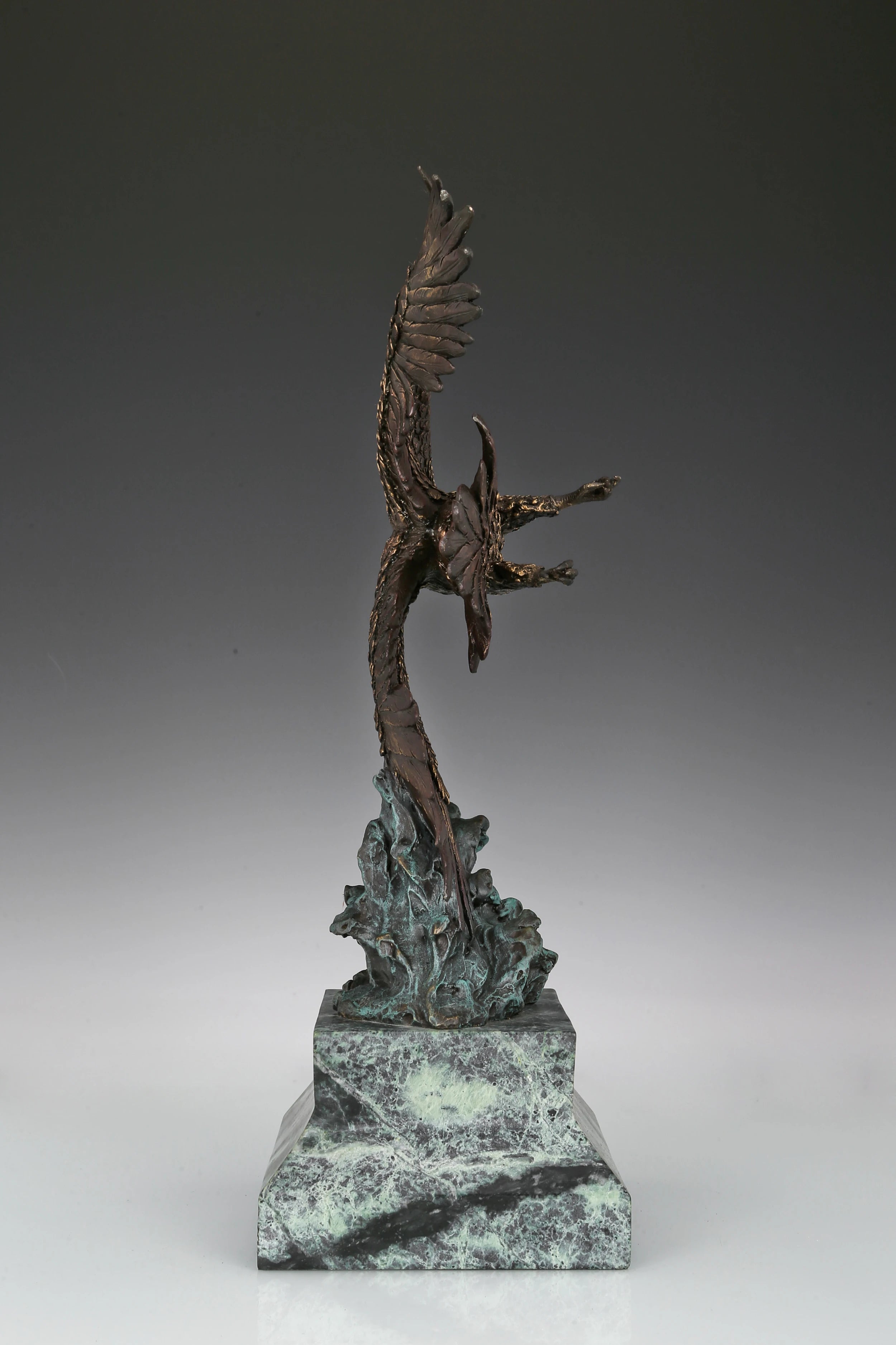 Eagle taking flight bronze sculpture with detailed feathers and marble base. Perfect wildlife statue for home decor, office, and collectors.