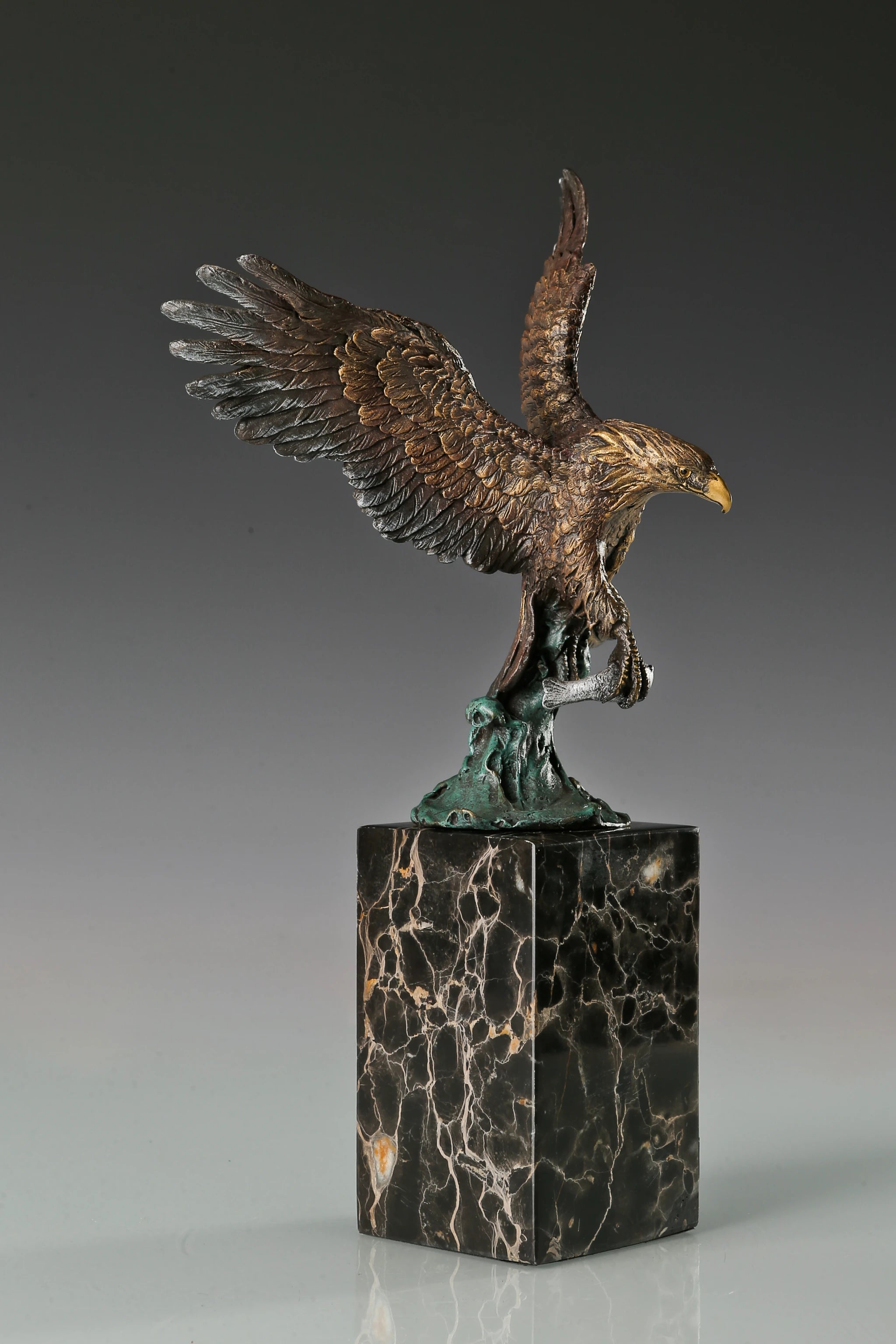handcrafted bronze eagle sculpture featuring spread wings and detailed feathers. this striking wildlife statue symbolizes strength, freedom, and prestige.