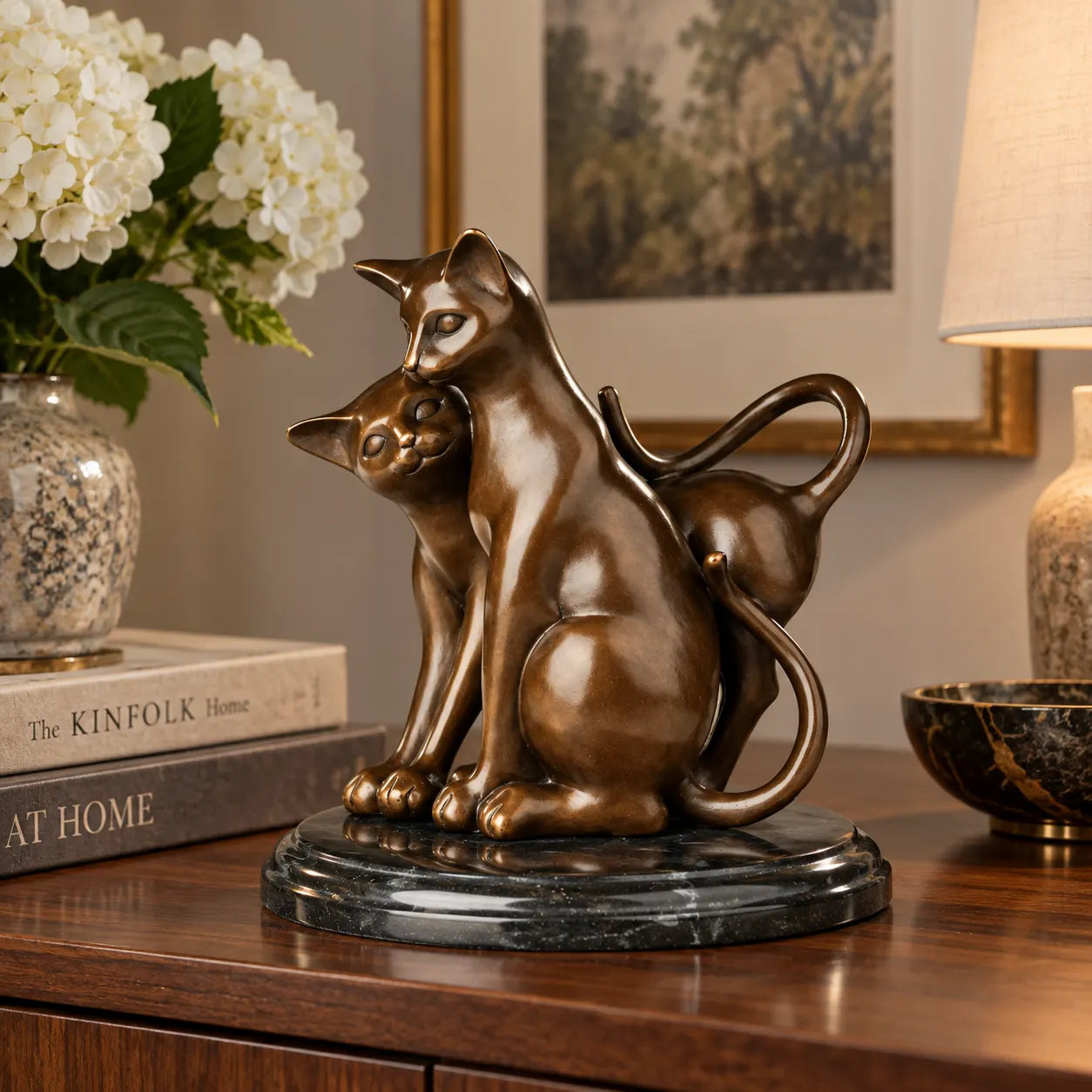 Loving cats bronze sculpture displayed in an elegant home interior
