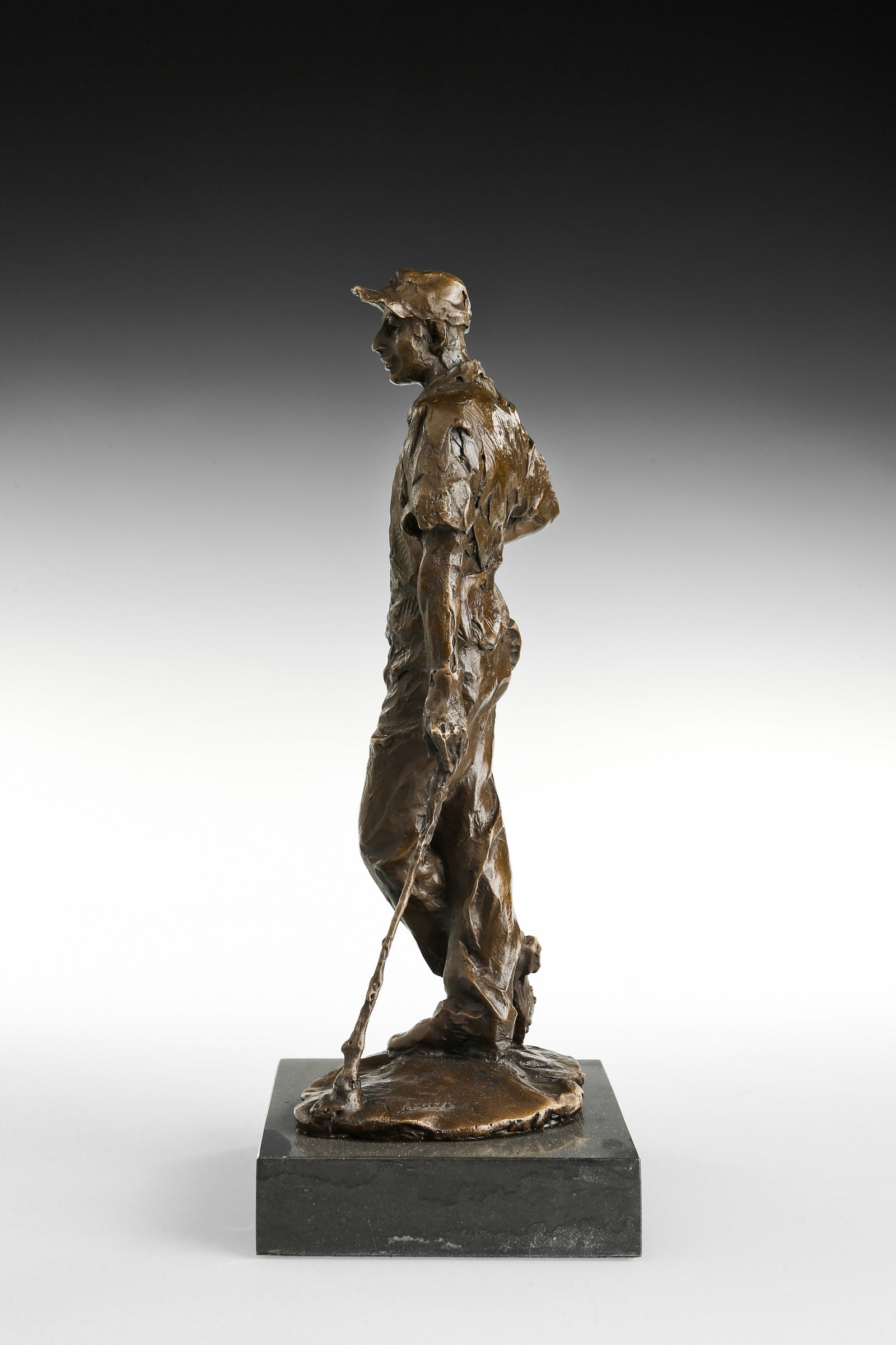 Male Golfer bronze sculpture, side studio view