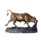Detailed bronze bullfight scene sculpture with charging bull and matador cape, realistic animal anatomy statue on veined black marble base, loss wax casting fine art.