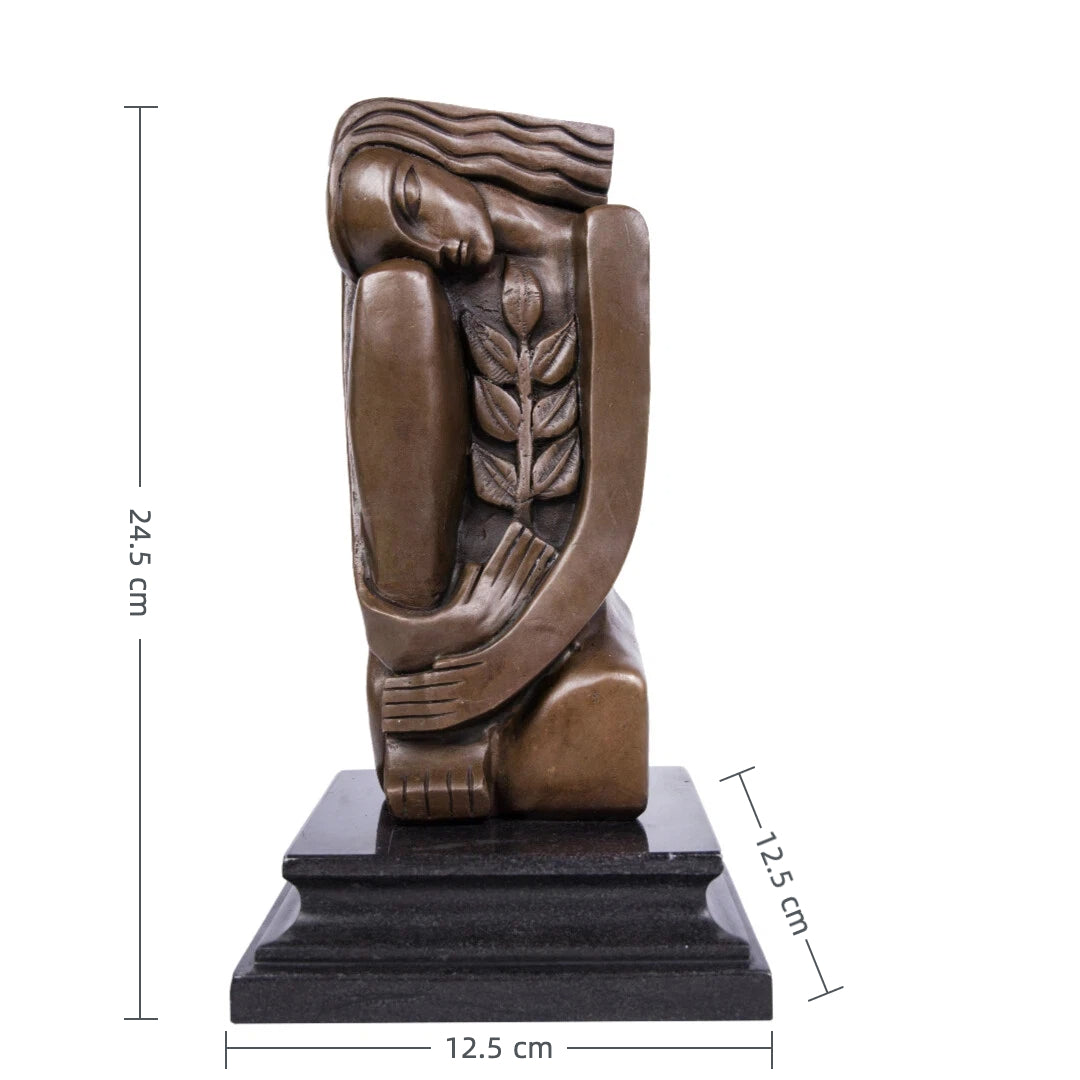 Modernist bronze female sculpture with olive branch on black marble base, minimalist peace statue for modern home decor.