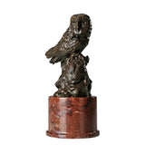 Angled view of bronze mother and baby owl statue showing layered feathers and warm patina