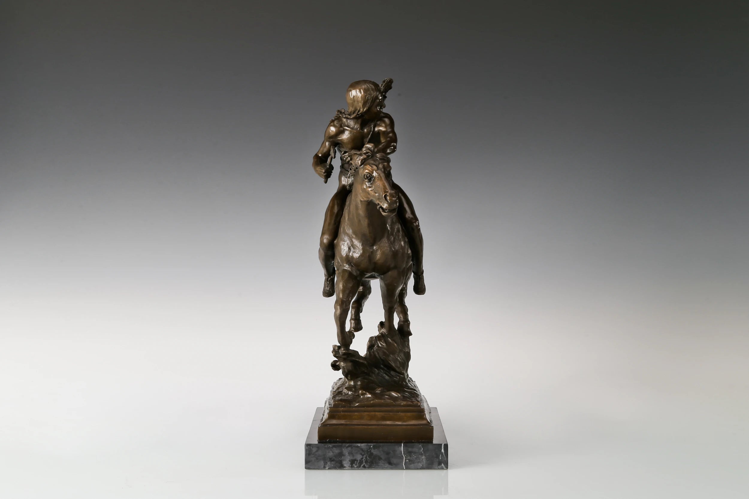 Handcrafted bronze Native American horse rider statue on a galloping horse