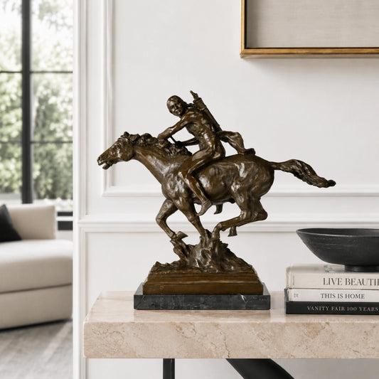 Native American horse rider bronze sculpture displayed in a refined Western-style interior