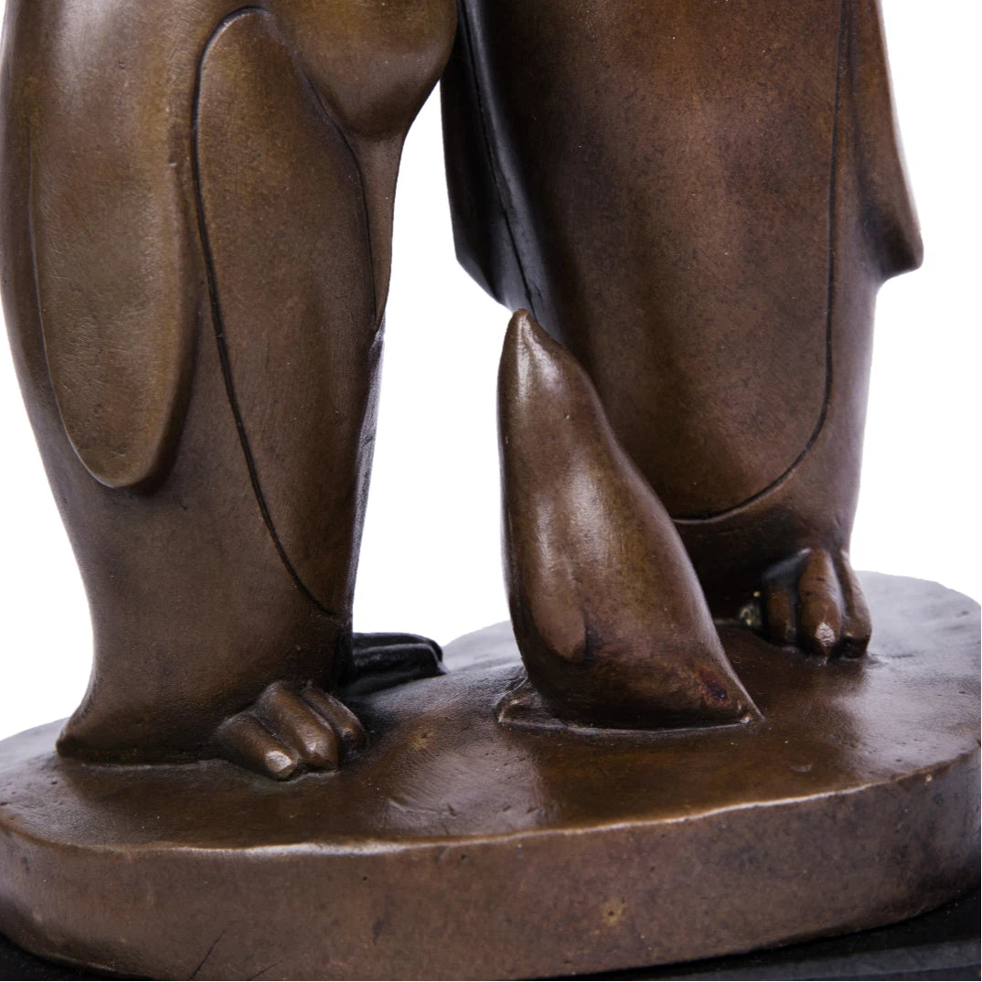 This penguin family bronze sculpture captures a tender moment between three penguins, rendered in clean, minimalist lines that emphasize form, balance, and emotional connection. Expertly crafted from solid bronze, the sculpture features a warm, natural finish that enhances its timeless character and tactile appeal.