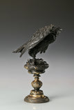 Elegant bronze eagle sculpture with ornate pedestal and detailed feathers. A refined statement piece symbolizing strength, control, and authority.
