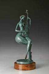 Three-quarter view of the green patina pipa player bronze sculpture with a cat beside her feet