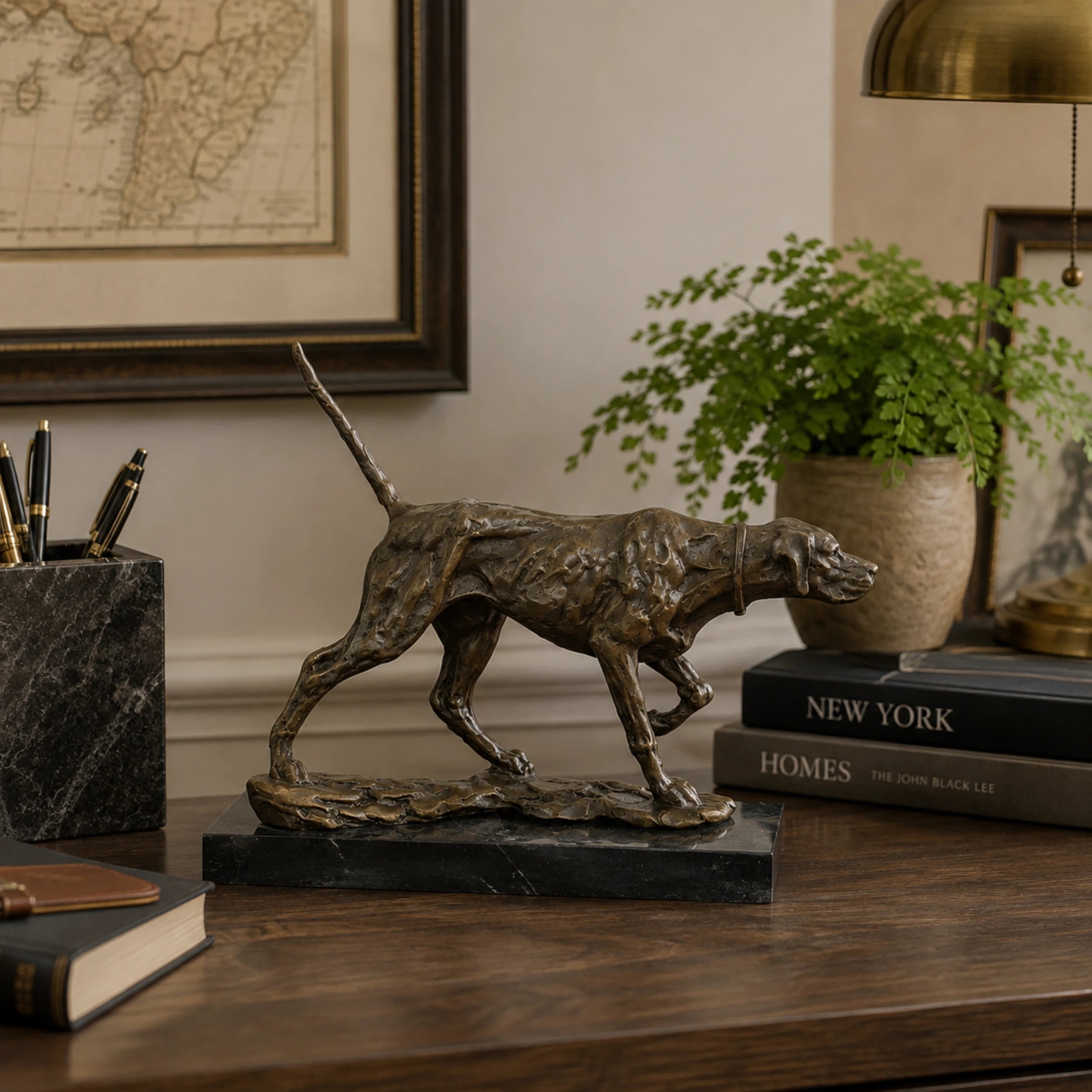 Pointing Hunting Dog Bronze Sculpture displayed in a styled interior