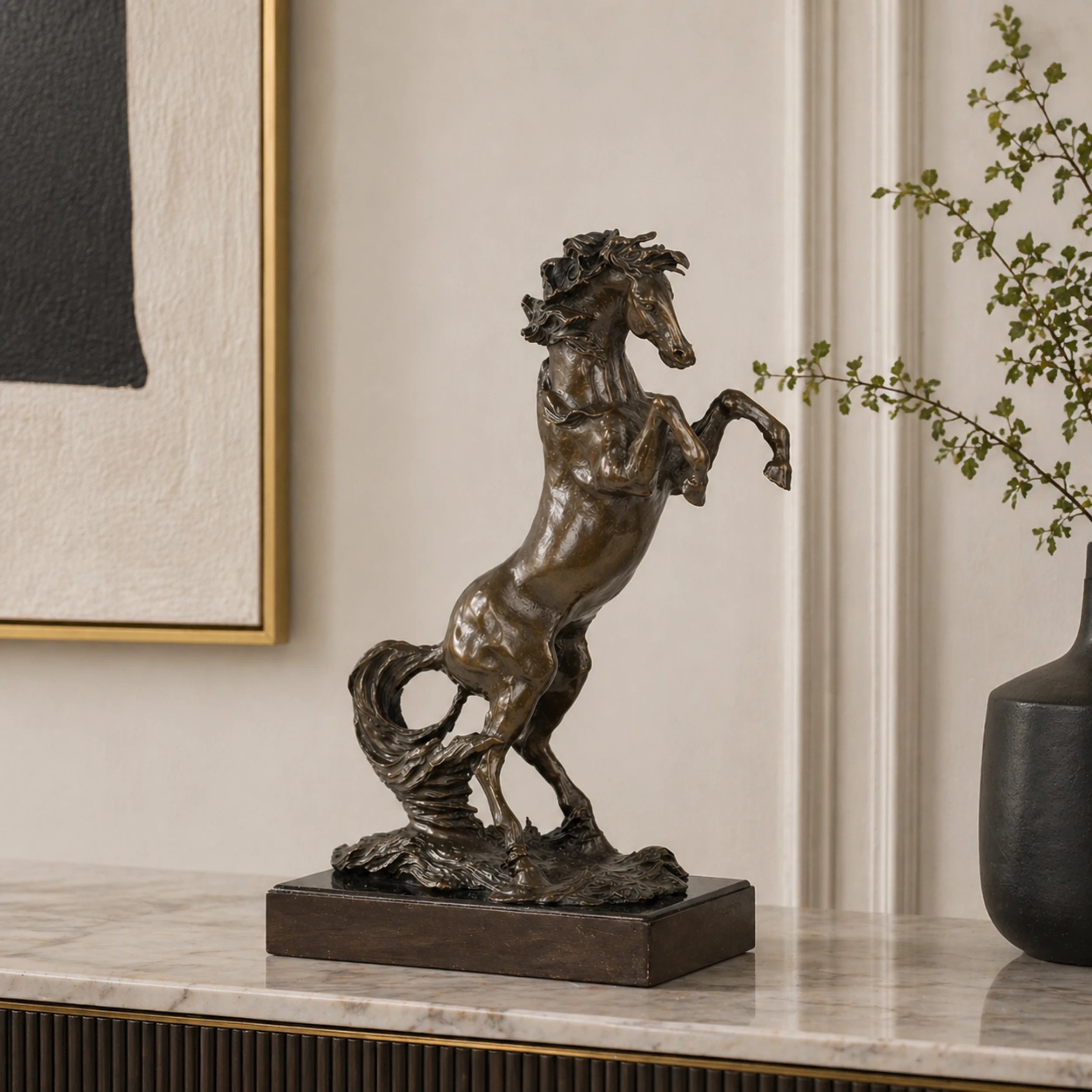 powerful rearing bronze horse statue with raised front legs and flowing mane, realistic stallion statue on black marble base, loss wax casting fine art.