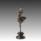 Raised leg ballerina bronze sculpture standing en pointe with arms overhead