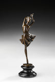 Three-quarter view of elegant bronze ballet dancer sculpture in a balancing pose