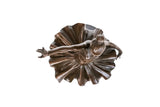 Detailed view of reaching ballerina bronze statue showing the sculpted tutu, ballet slippers, and bronze finish
