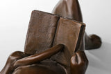 Detail of the book held by the reclining reading cat bronze sculpture