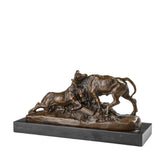 Bronze sculpture of two bulls fighting with dynamic movement and detailed musculature