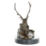 Back view of handcrafted reclining stag bronze sculpture